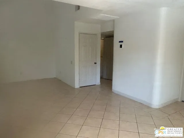 a view of a glass door with a yard from a balcony