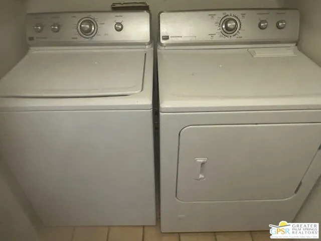 a bathroom with a granite countertop sink toilet a mirror and vanity