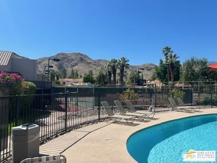 a view of a swimming pool with a patio