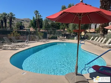 a view of a swimming pool with a patio