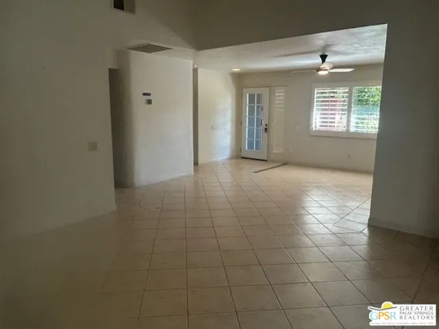 a view of an empty room and window