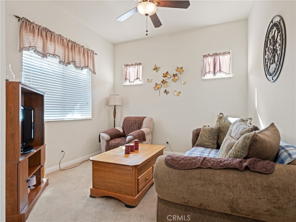 10588 Archerwill Road Apple Valley, CA 92308 - Photo 11 of 35 a bedroom with a bed and wooden floor