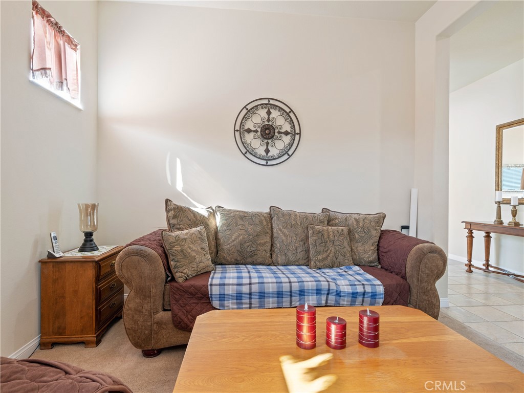 10588 Archerwill Road Apple Valley, CA 92308 - Photo 12 of 35 a living room with furniture a couch and wooden floor