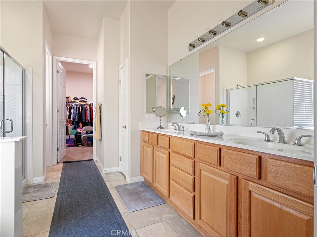 10588 Archerwill Road Apple Valley, CA 92308 - Photo 24 of 35 a en suite bathroom with a sink and a mirror