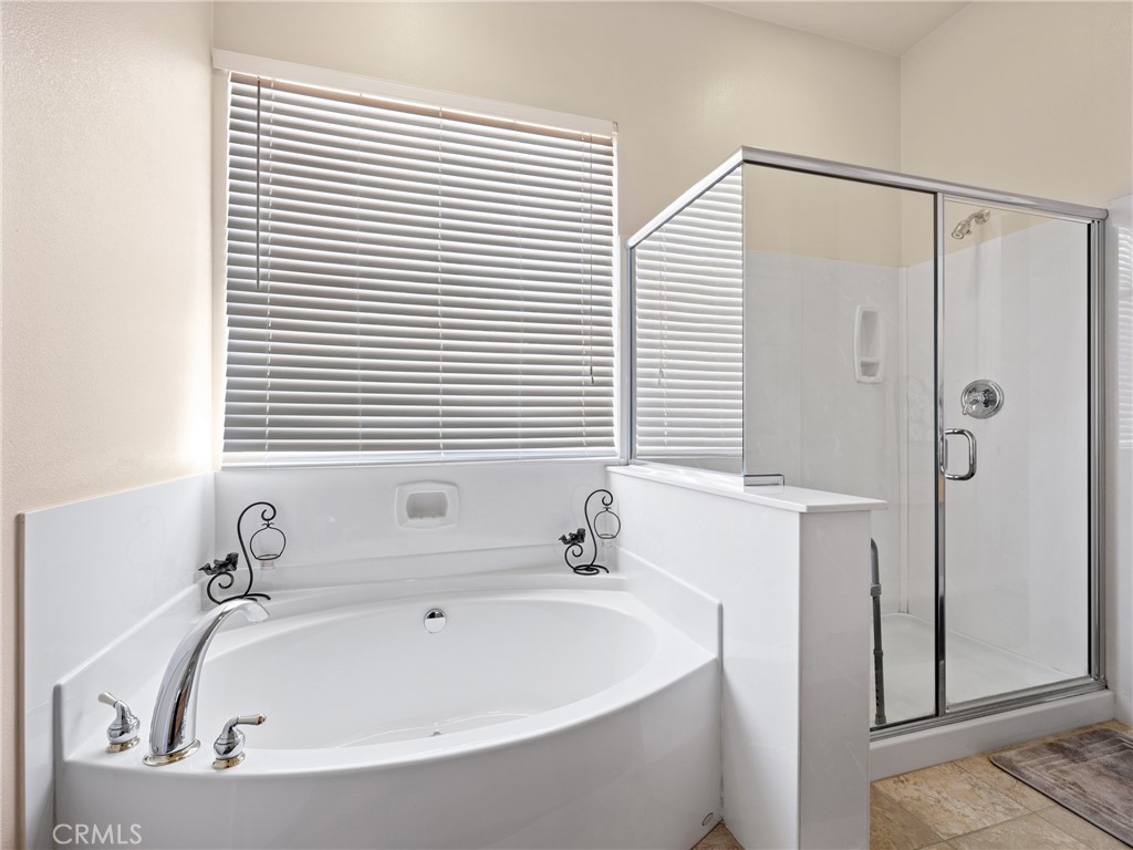10588 Archerwill Road Apple Valley, CA 92308 - Photo 25 of 35 a white bath tub sitting next to a white sink