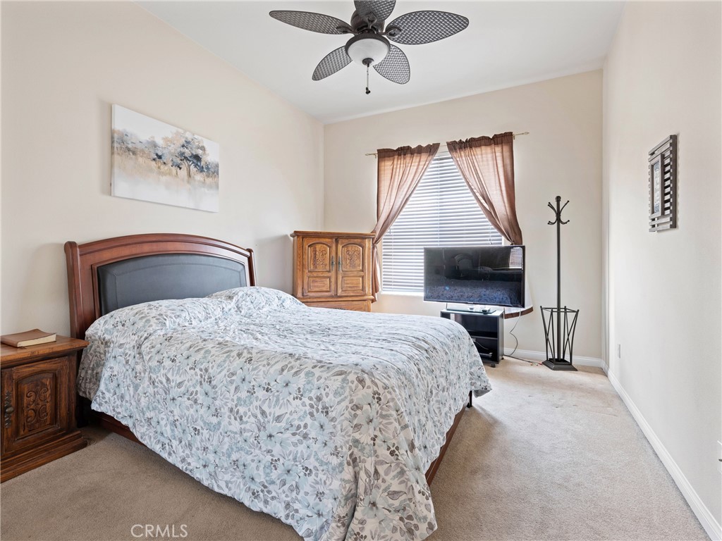 10588 Archerwill Road Apple Valley, CA 92308 - Photo 27 of 35 a bedroom with a bed and a painting on the wall