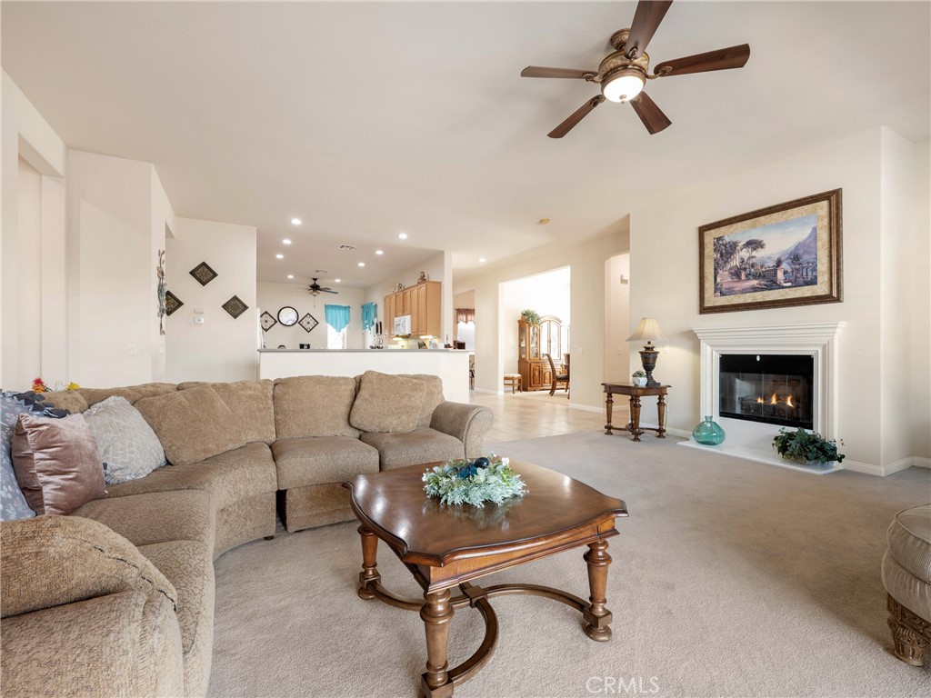 10588 Archerwill Road Apple Valley, CA 92308 - Photo 7 of 35 a living room with furniture and a fireplace