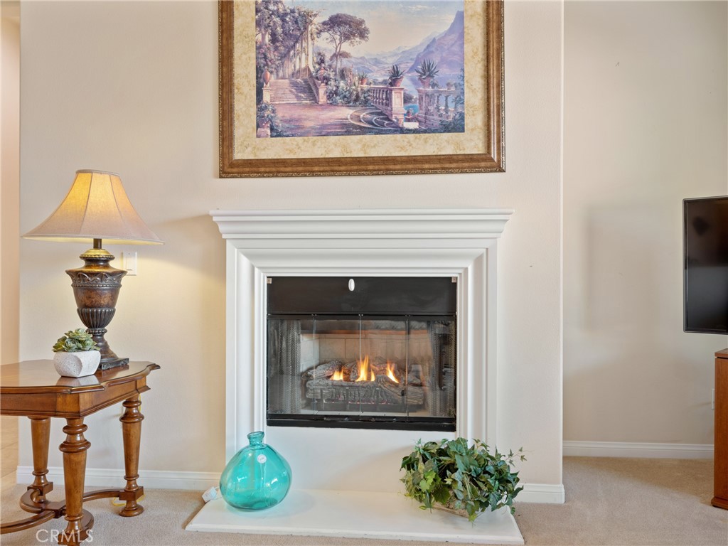 10588 Archerwill Road Apple Valley, CA 92308 - Photo 8 of 35 a living room with furniture and a fireplace