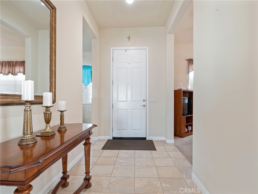 10588 Archerwill Road Apple Valley, CA 92308 - Photo 10 of 35 a view of a workspace with furniture and gym equipment