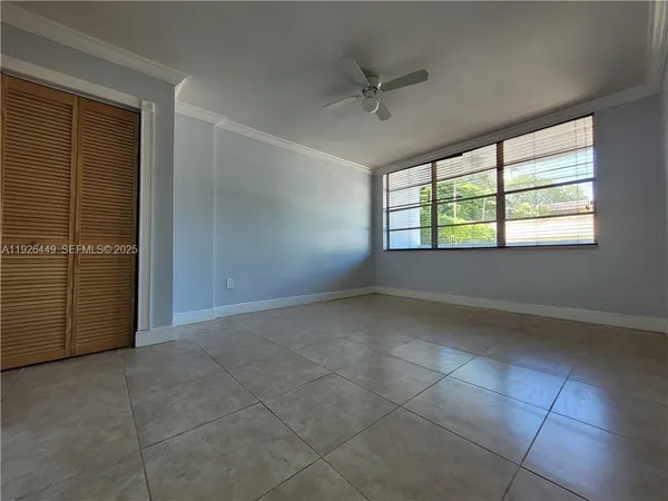 a view of an empty room with a window