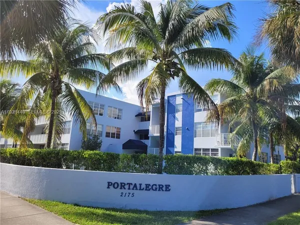 a view of a palm trees in front of a house