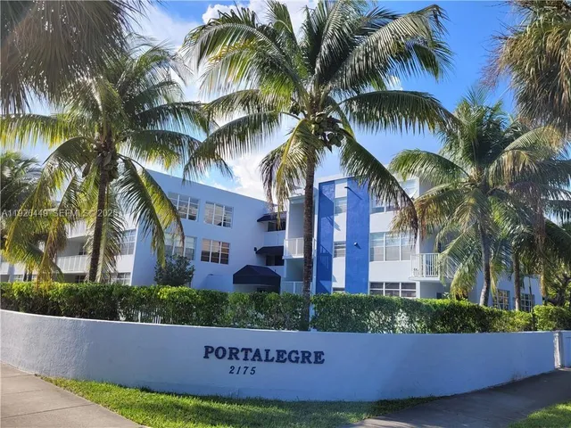 a view of a palm trees in front of a house