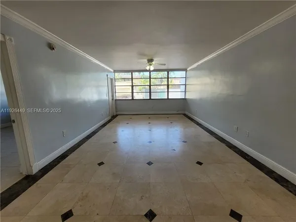 an empty room with windows and windows