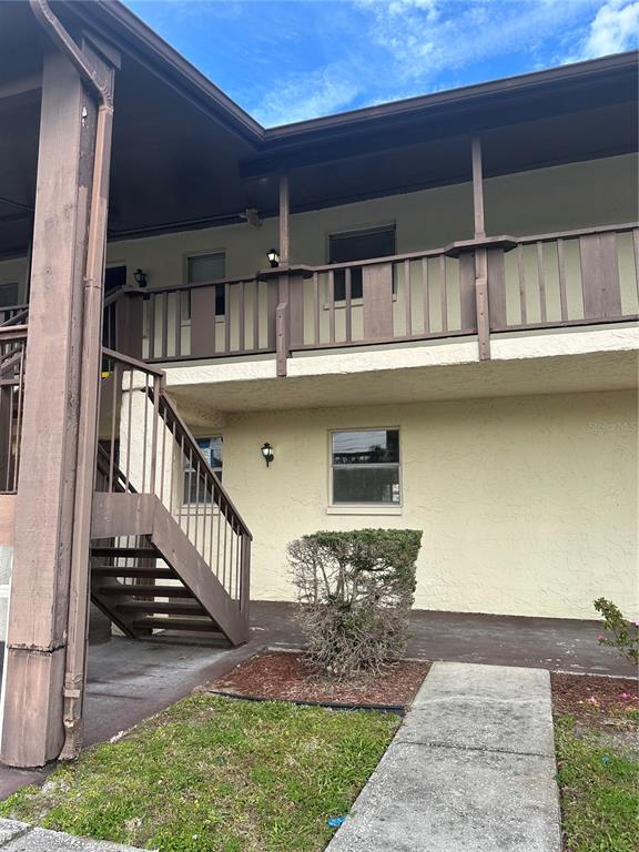 8440 Old Post Road, Unit 202 Port Richey, FL 34668 - Photo 2 of 17 a view of front door of house