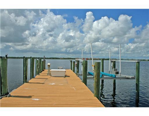 2640 Northwest Collins Cove Road Stuart, FL 34994 - Photo 6 of 21 a view of a balcony with chairs