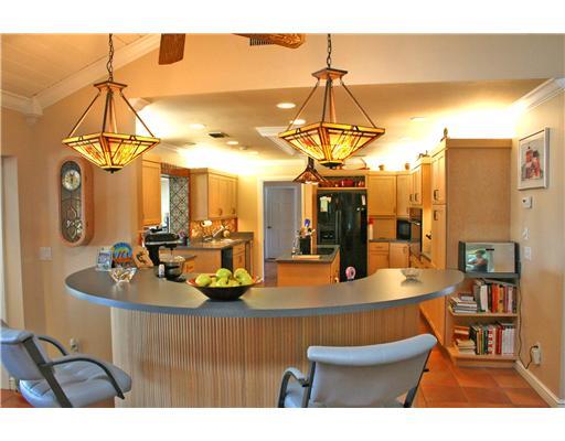 2640 Northwest Collins Cove Road Stuart, FL 34994 - Photo 9 of 21 a room with furniture and a chandelier