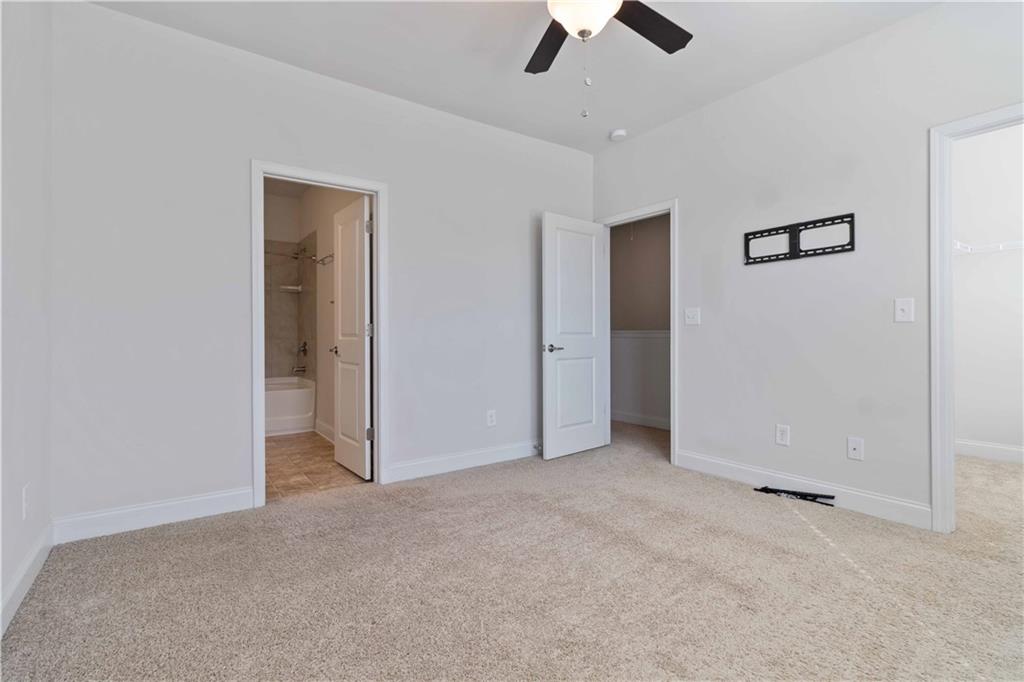 3437 Sumersbe Court Atlanta, GA 30349 - Photo 13 of 25 an empty room with chandelier fan