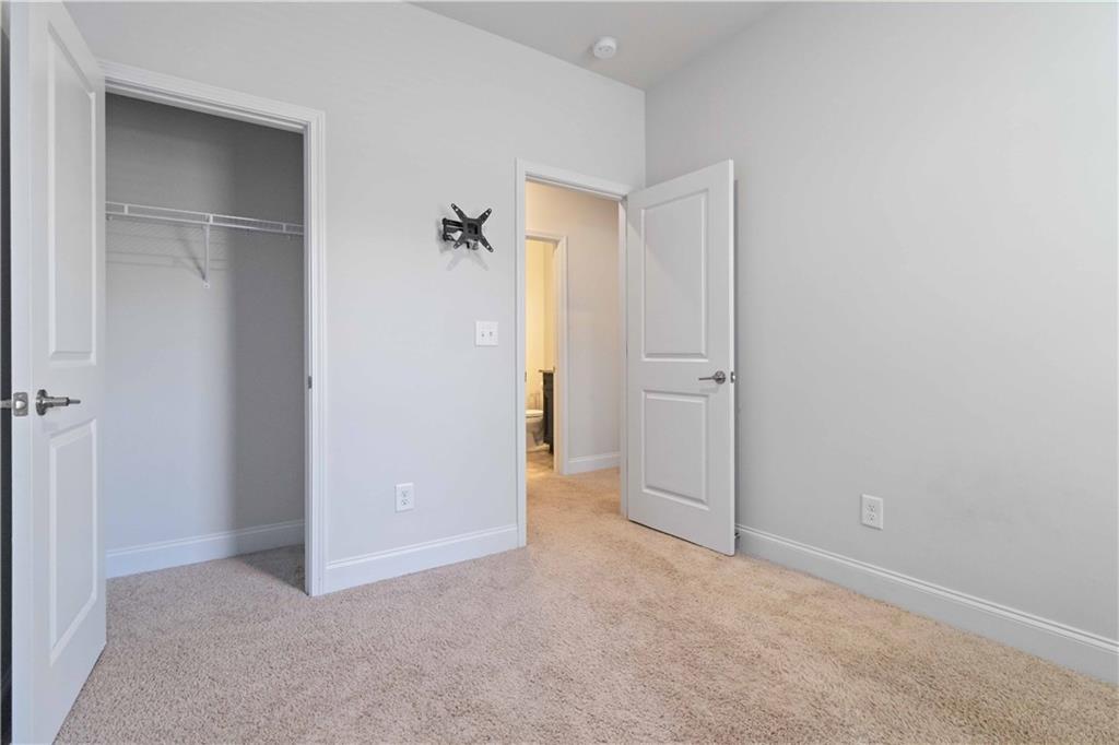 3437 Sumersbe Court Atlanta, GA 30349 - Photo 18 of 25 an empty room with closet and a bathroom