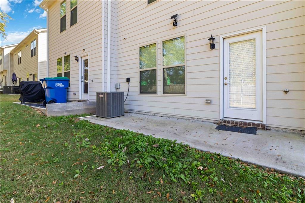 3437 Sumersbe Court Atlanta, GA 30349 - Photo 21 of 25 a view of backyard of house with outdoor seating
