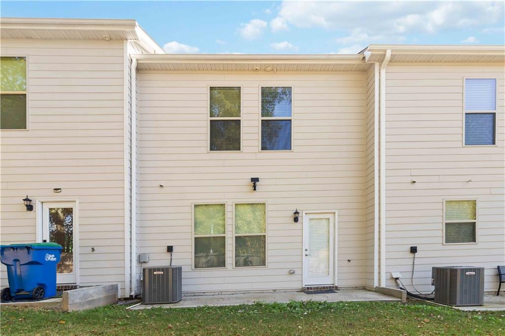 3437 Sumersbe Court Atlanta, GA 30349 - Photo 22 of 25 a view of a house with a yard