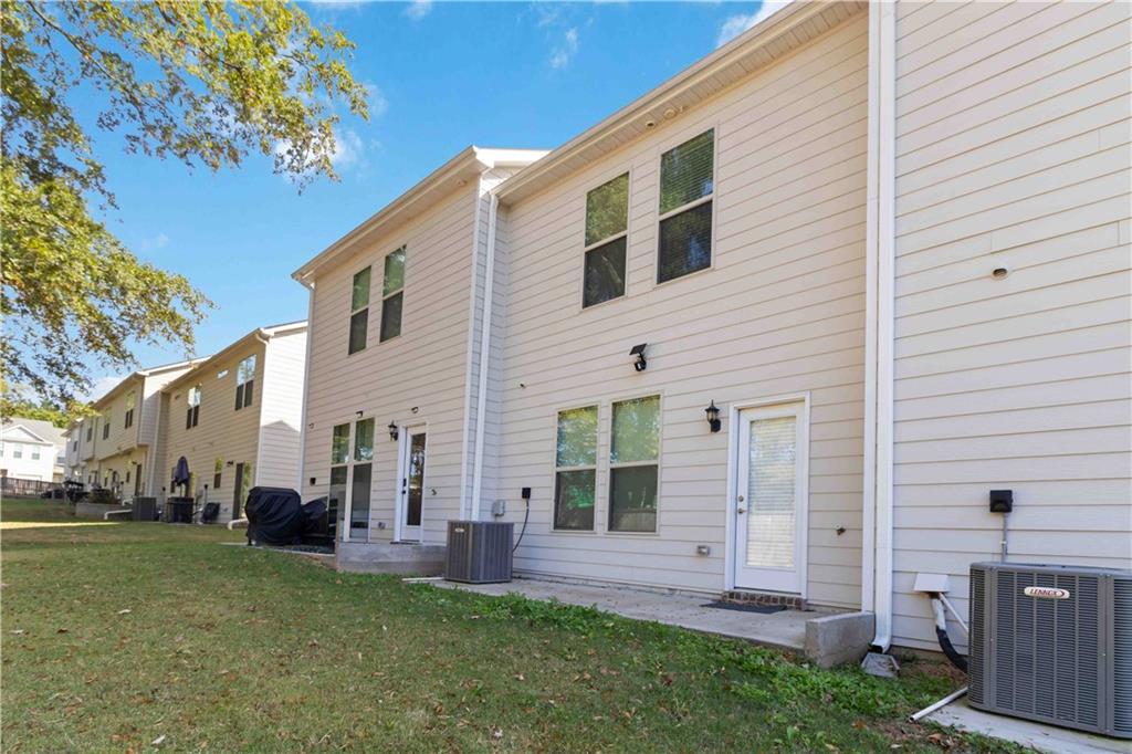 3437 Sumersbe Court Atlanta, GA 30349 - Photo 24 of 25 a view of a house with backyard