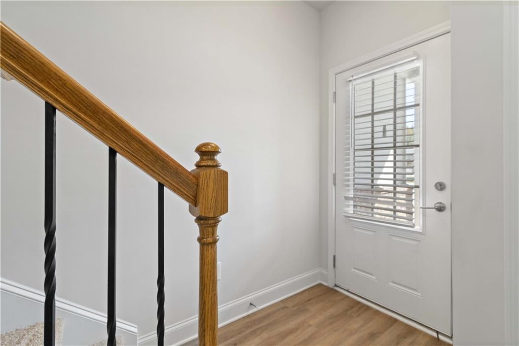 3437 Sumersbe Court Atlanta, GA 30349 - Photo 3 of 25 a view of entryway with wooden floor and stairs
