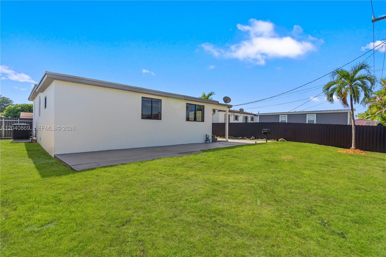 31 West 64th Street Hialeah, FL 33012 - Photo 42 of 49 a front view of house with yard and swimming pool