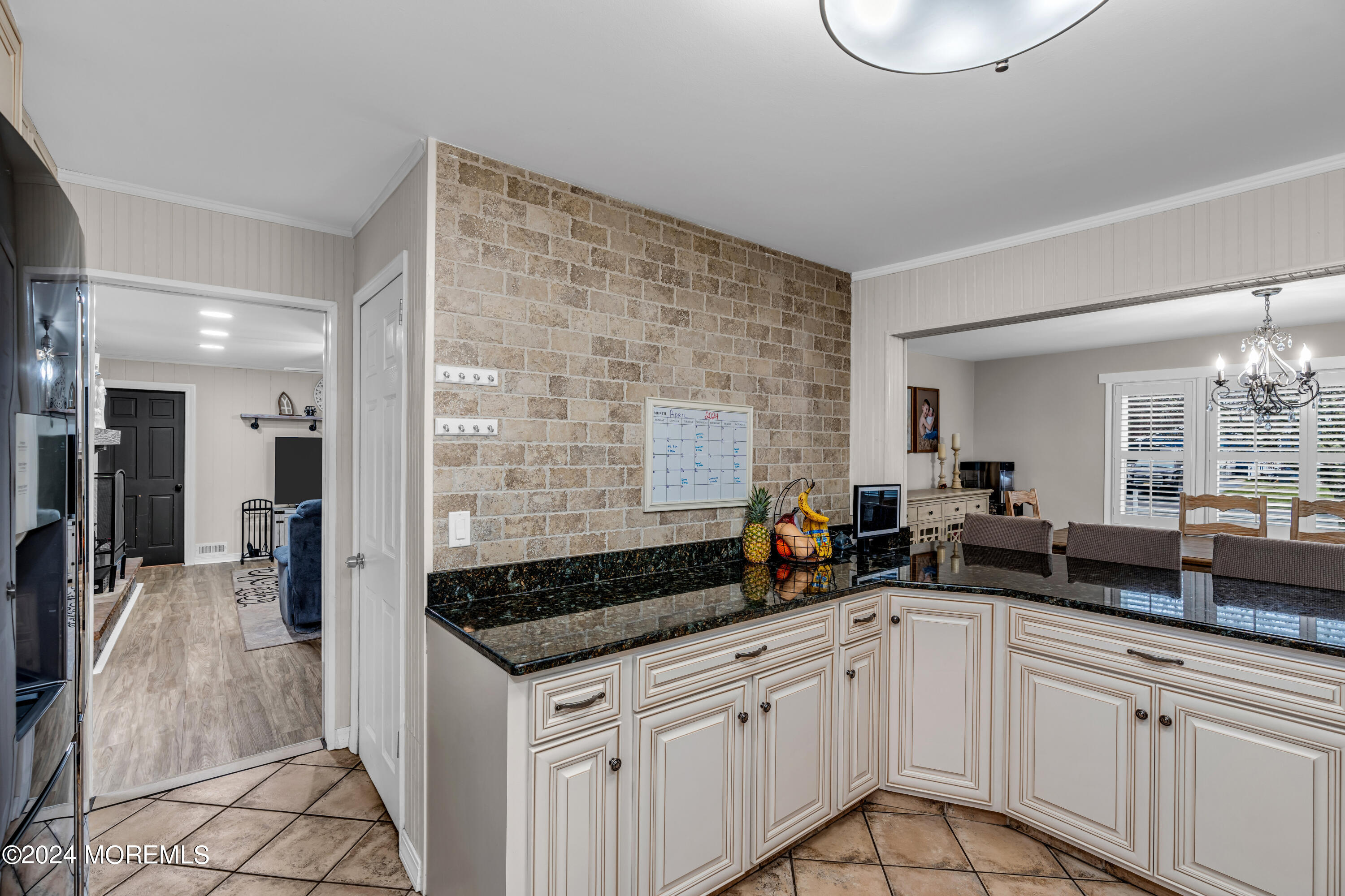 2 Maple Avenue Freehold, NJ 07728 - Photo 14 of 41 a kitchen with granite countertop a sink a stove and cabinets