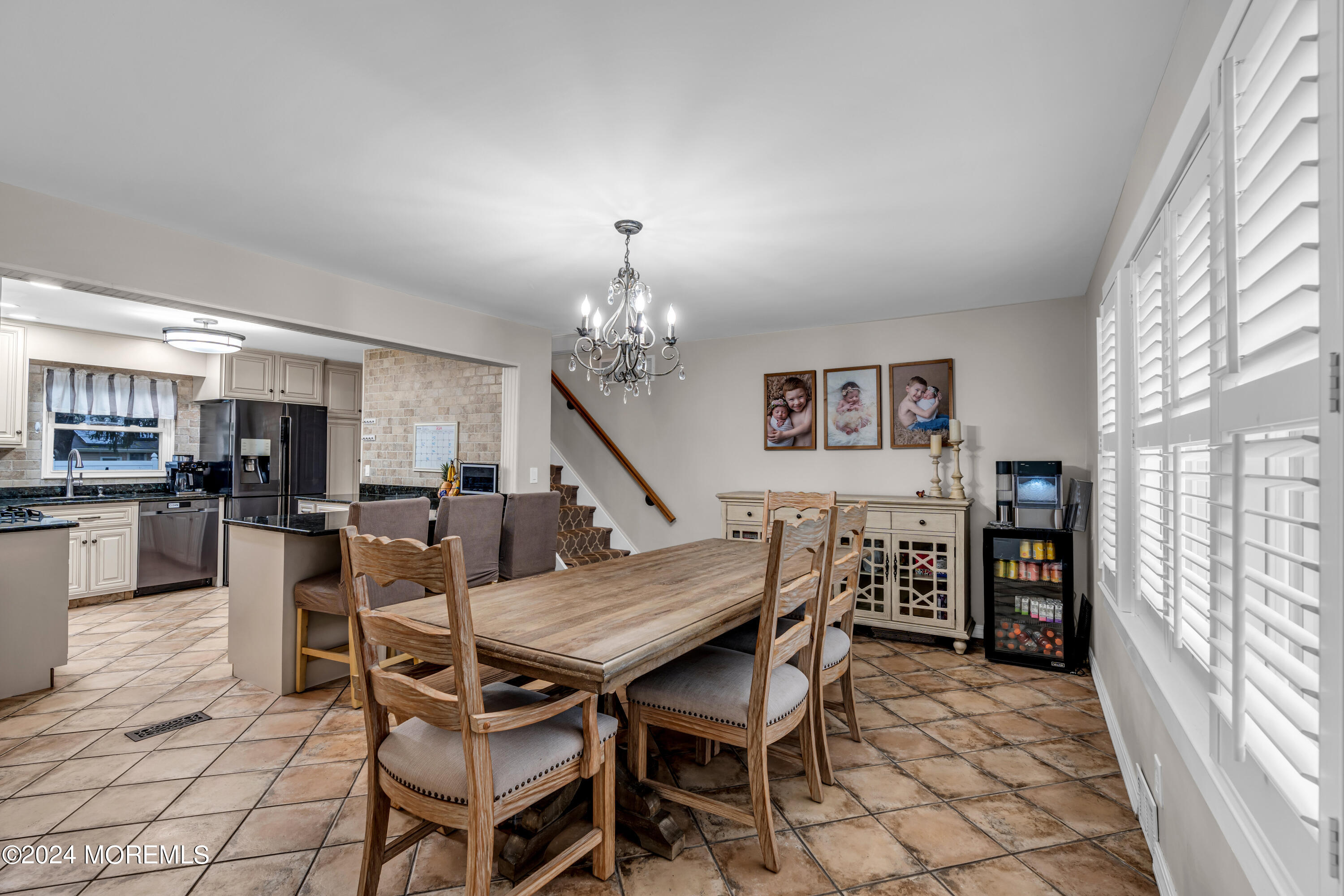 2 Maple Avenue Freehold, NJ 07728 - Photo 17 of 41 a view of a dining room with furniture and a chandelier
