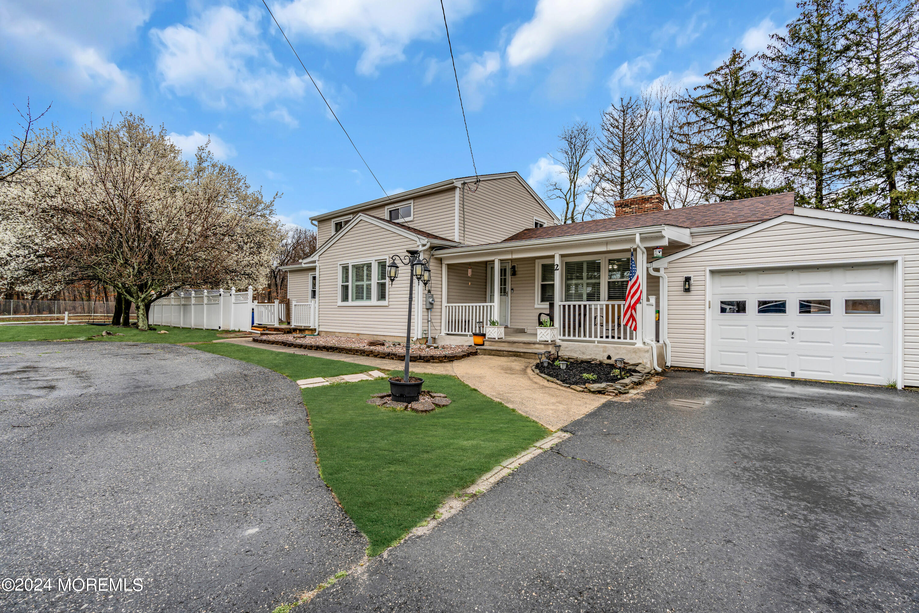 2 Maple Avenue Freehold, NJ 07728 - Photo 2 of 41 a front view of a house with a yard and trees