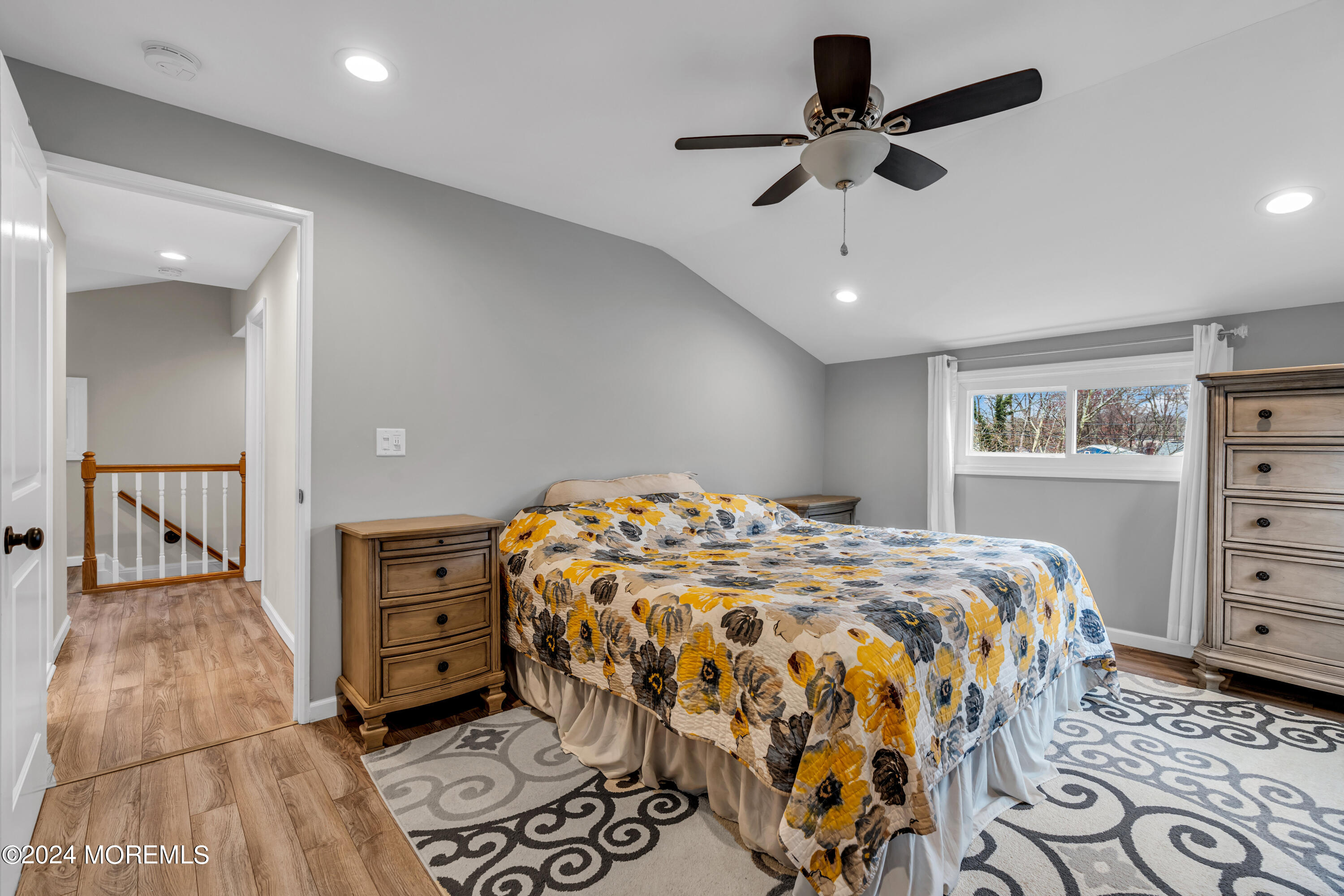 2 Maple Avenue Freehold, NJ 07728 - Photo 24 of 41 a bedroom with a bed and a chandelier