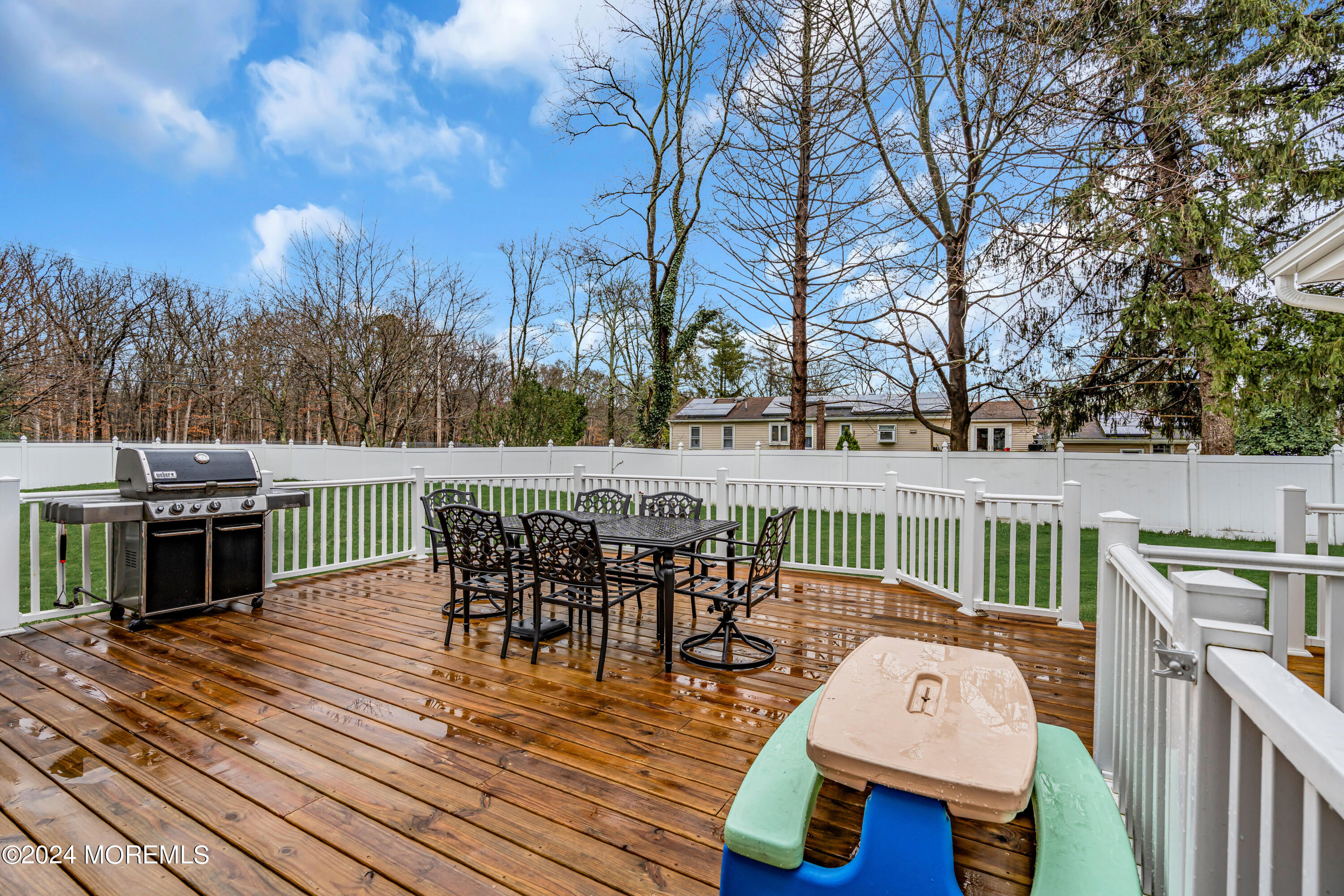 2 Maple Avenue Freehold, NJ 07728 - Photo 33 of 41 a view of a deck with furniture and trees around