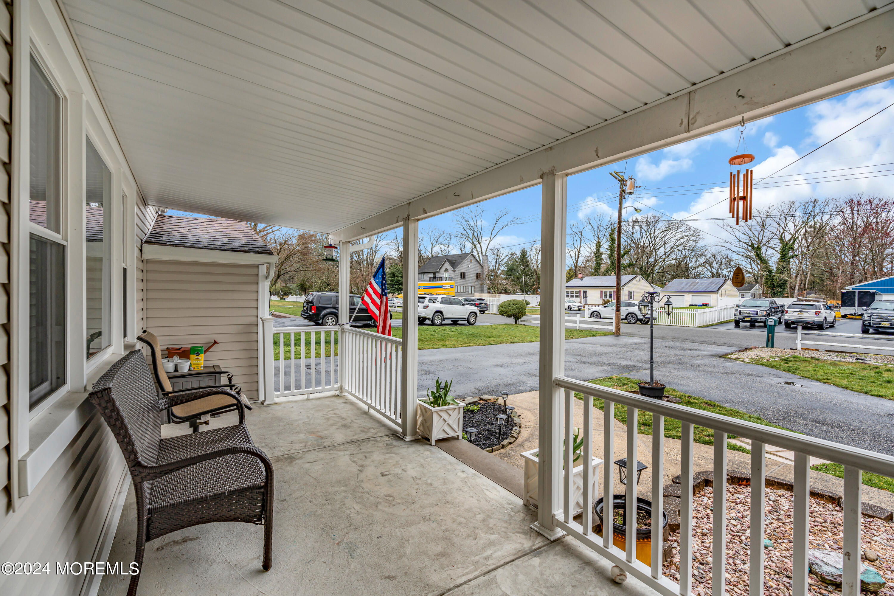 2 Maple Avenue Freehold, NJ 07728 - Photo 5 of 41 a view of a porch with furniture and floor to ceiling window