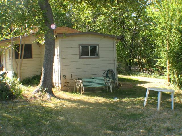 17815 Irish Road Redding, CA 96003 - Photo 3 of 3 a backyard of a house with table and chairs