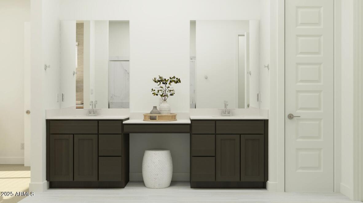 9646 West Flower Street Phoenix, AZ 85037 - Photo 10 of 25 a bathroom with a sink vanity and mirror