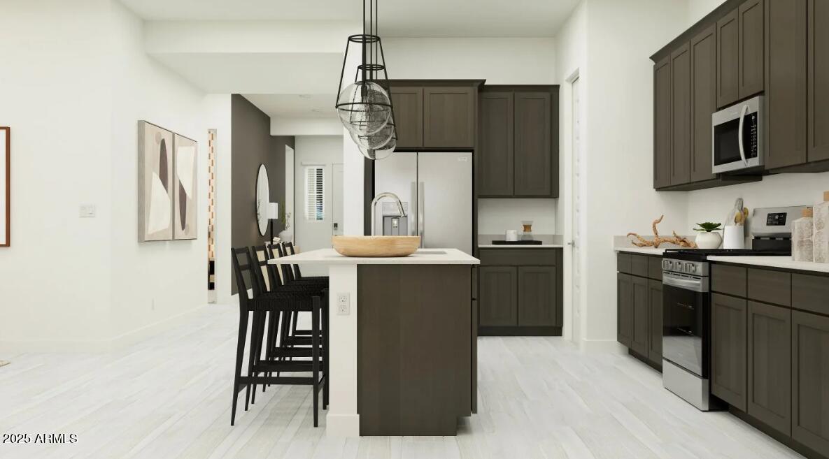 9646 West Flower Street Phoenix, AZ 85037 - Photo 3 of 25 a kitchen with a refrigerator and a stove top oven