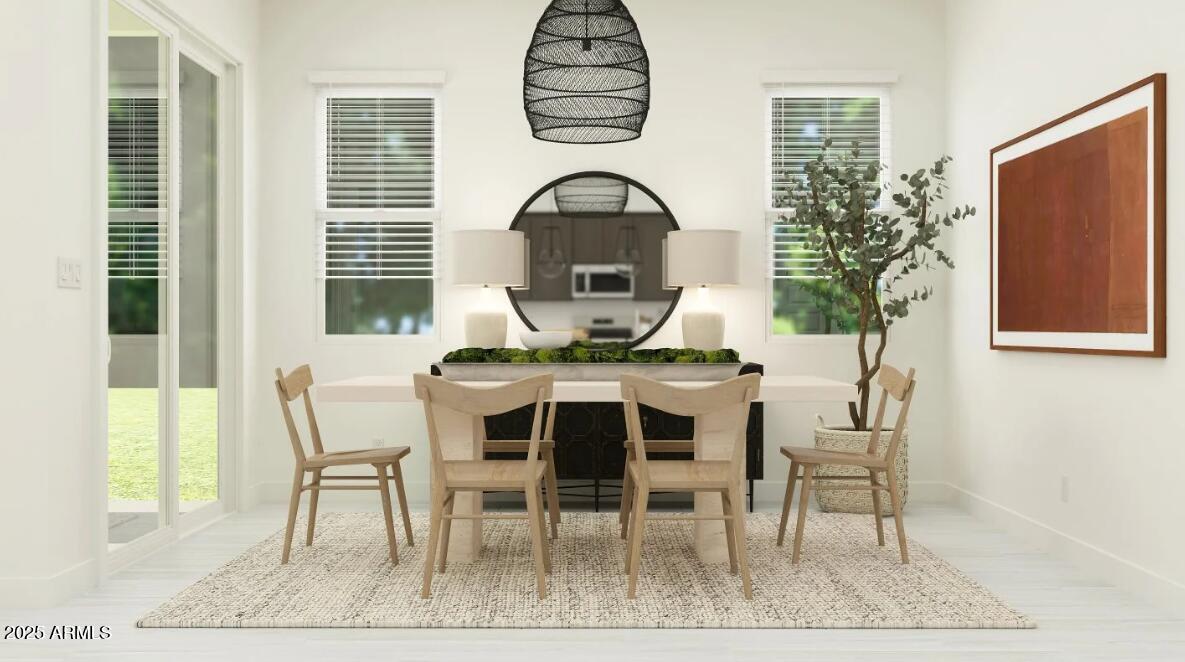 9646 West Flower Street Phoenix, AZ 85037 - Photo 4 of 25 a view of a dining room with furniture window and wooden floor