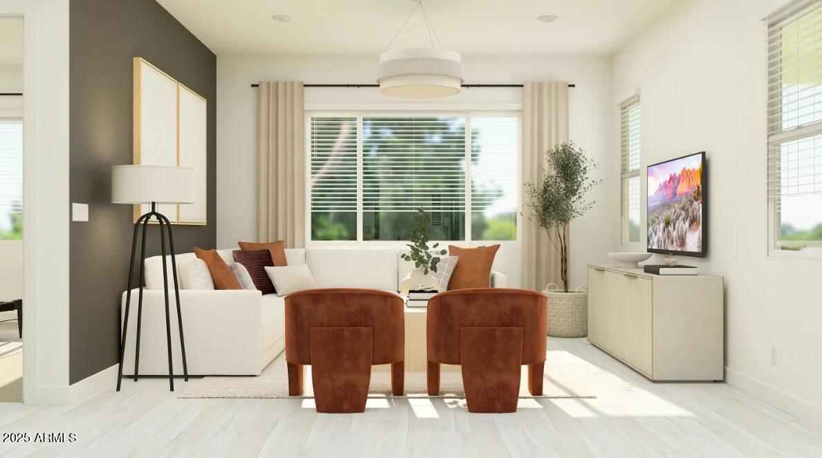 9646 West Flower Street Phoenix, AZ 85037 - Photo 7 of 25 a living room with furniture and a large window