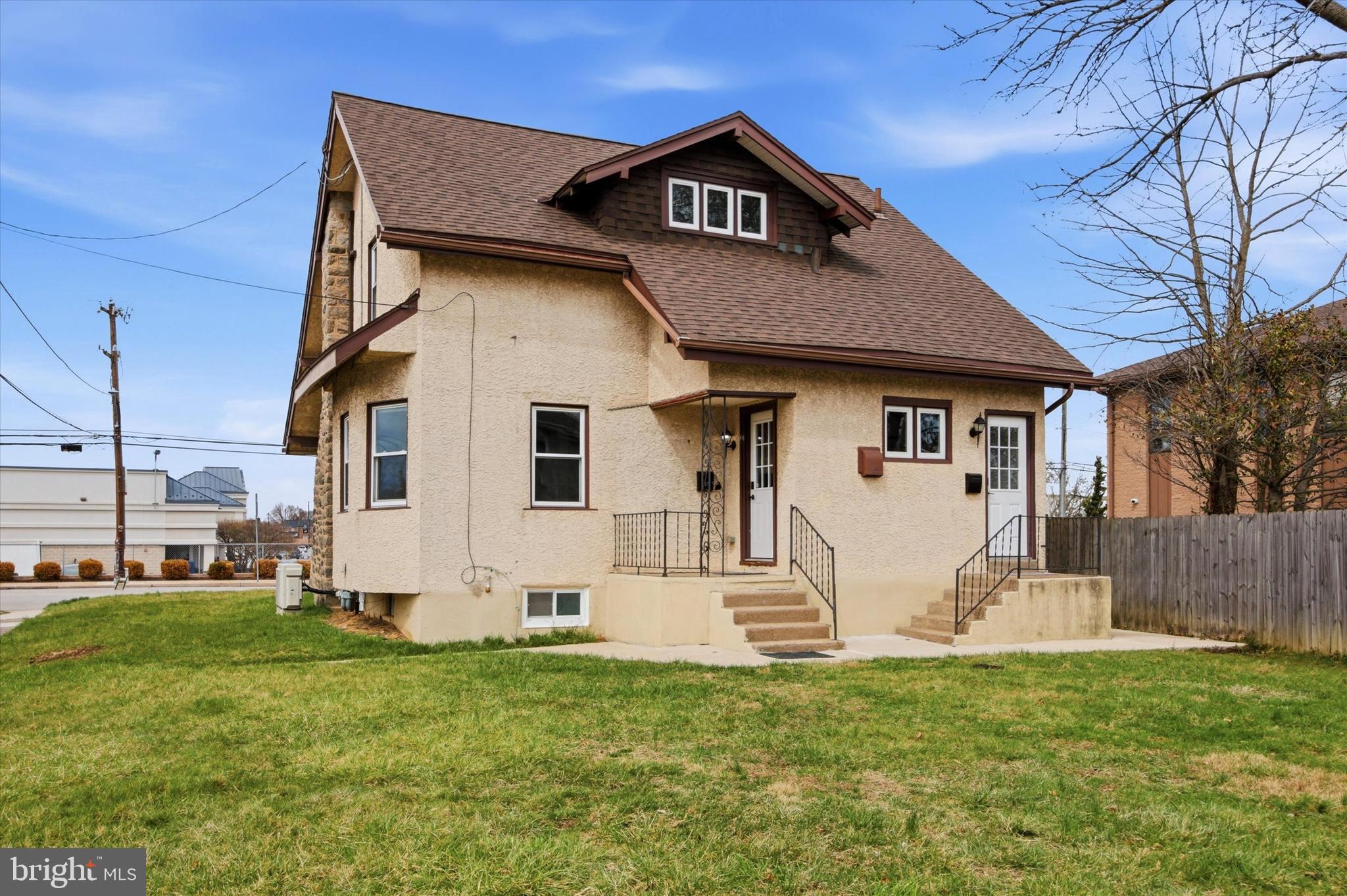 101 North Eagle Road, Unit 1 Havertown, PA 19083 - Photo 9 of 9 a front view of a house with a yard