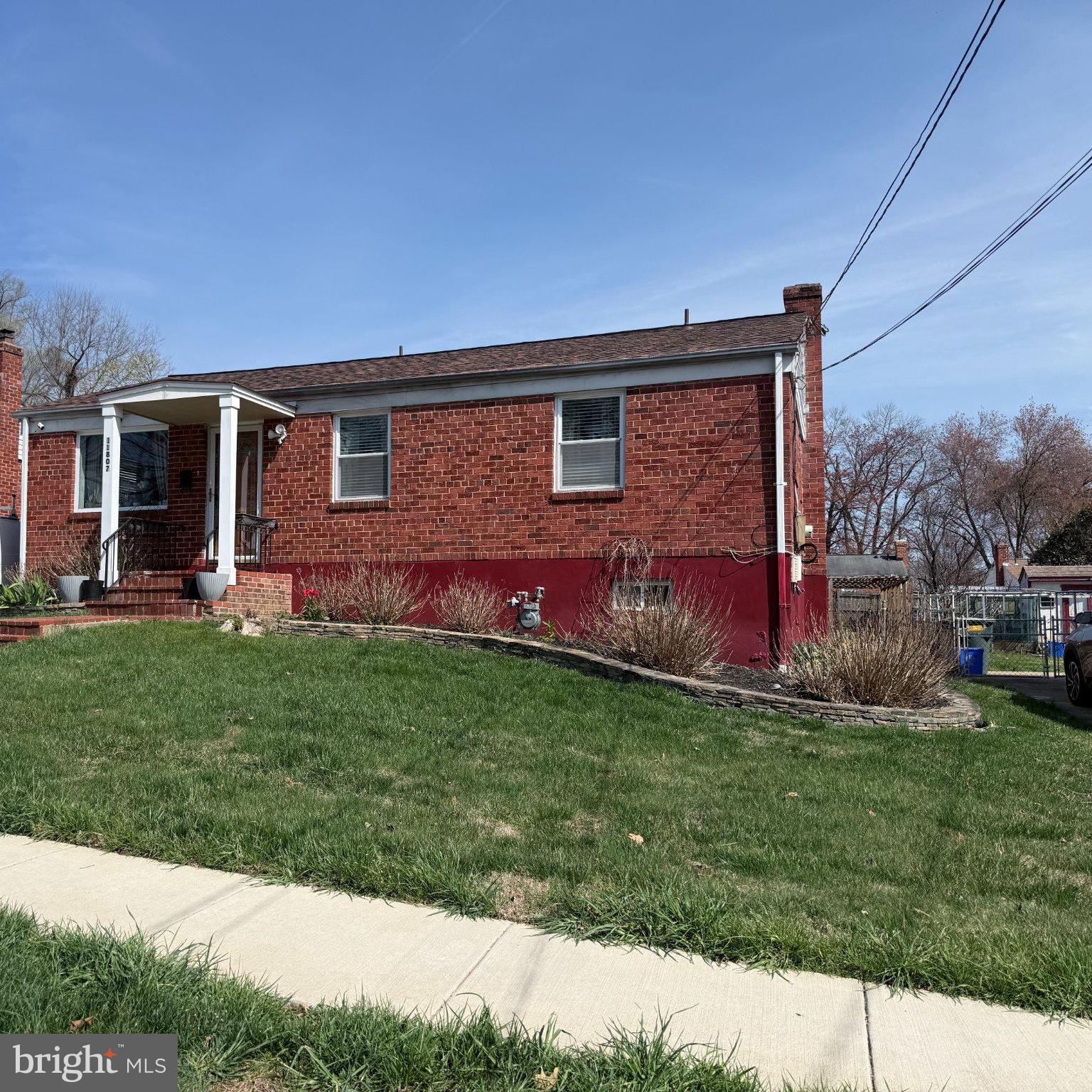 11807 Rocking Horse Road Rockville, MD 20852 - Photo 3 of 3 Charming brick home with lush lawn.