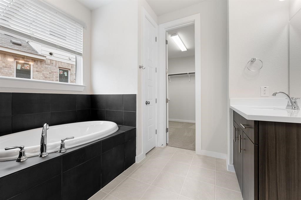112 Alicante Lane Georgetown, TX 78628 - Photo 14 of 36 a bathroom with a sink and a mirror