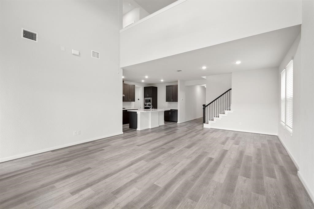 112 Alicante Lane Georgetown, TX 78628 - Photo 18 of 36 a view of a kitchen with wooden floor and a kitchen