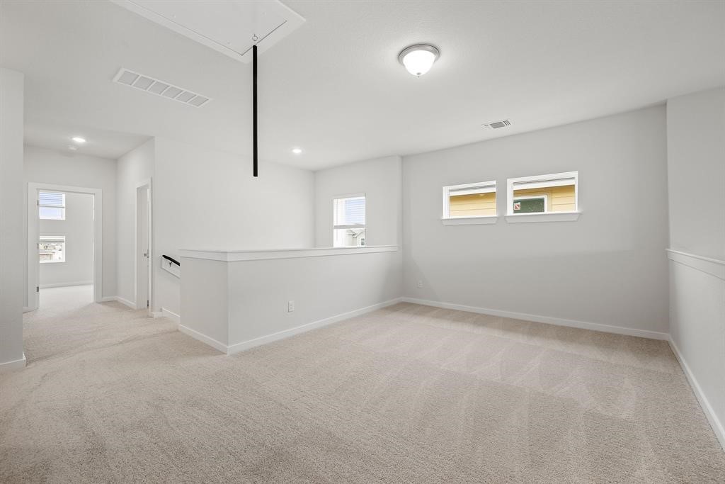 112 Alicante Lane Georgetown, TX 78628 - Photo 25 of 36 an empty room with windows and entrance