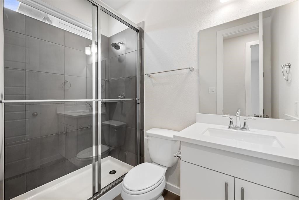 112 Alicante Lane Georgetown, TX 78628 - Photo 28 of 36 a bathroom with a sink a toilet and shower