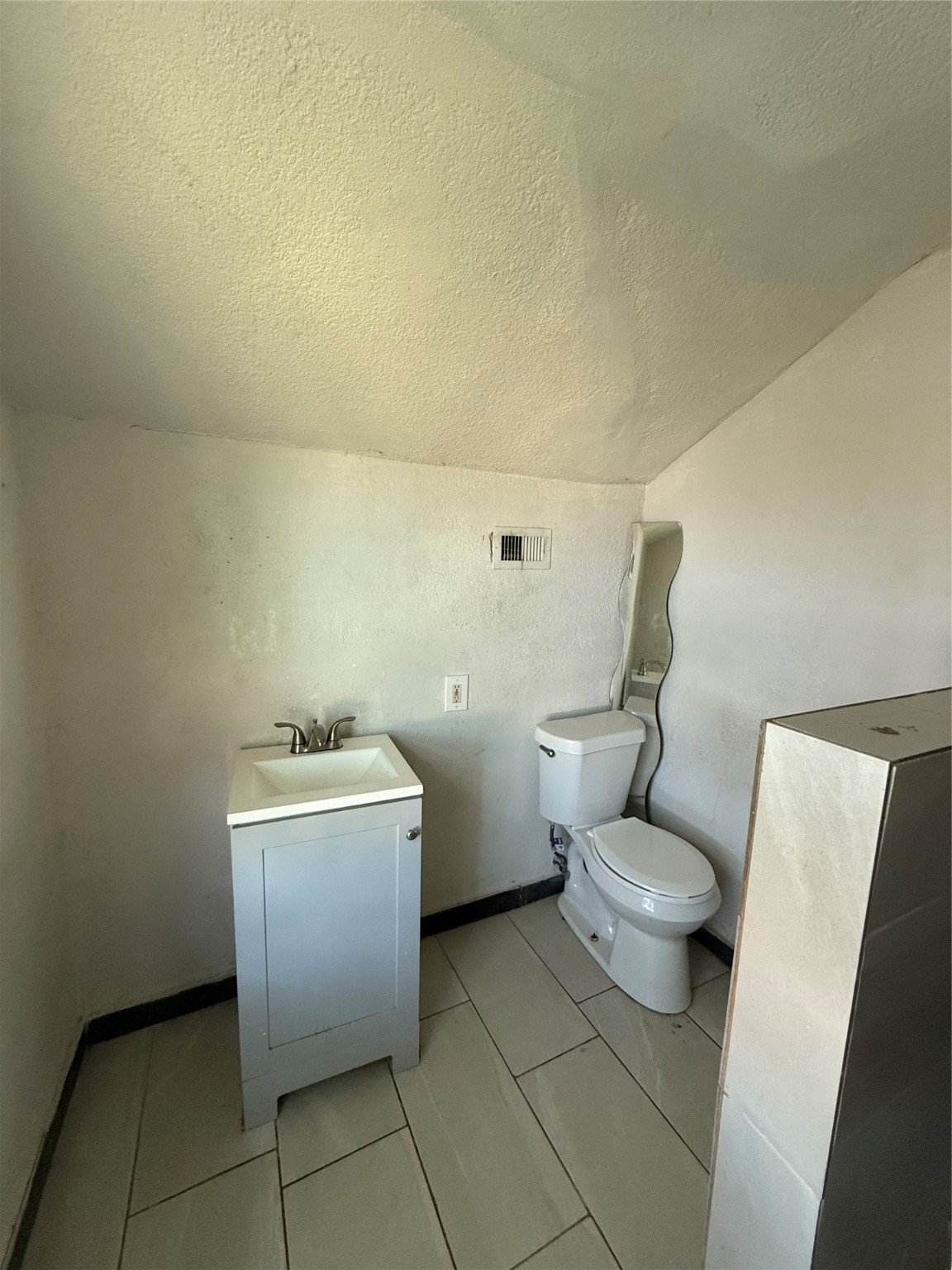 7227 St Augustine Street Houston, TX 77021 - Photo 19 of 20 a bathroom with a toilet and a sink