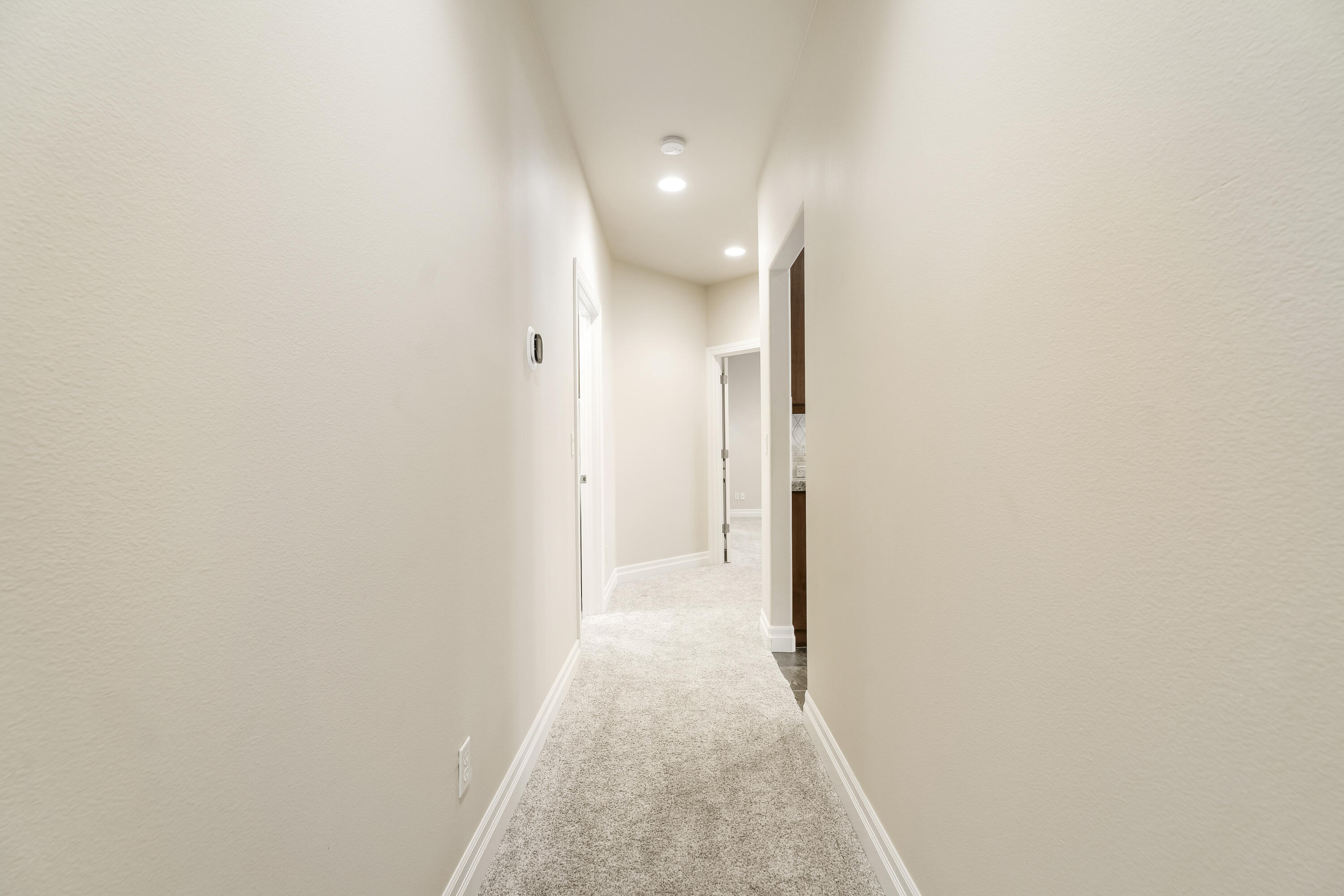 784 Ribbon Falls Road Redmond, OR 97756 - Photo 36 of 79 a view of a hallway with wooden floor