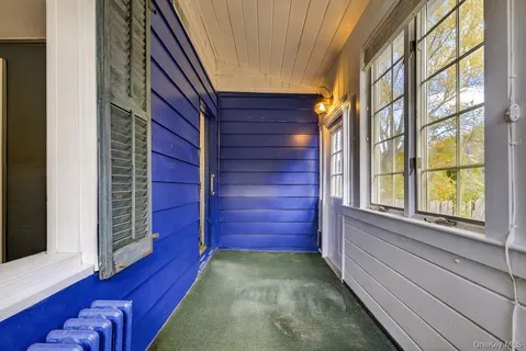 a view of front door of house with stairs