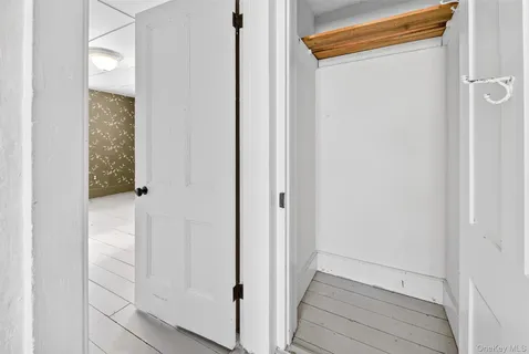 a view of a small space with wooden floor