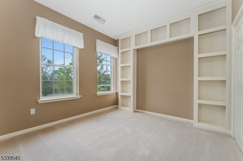 6015 Brookfield Glen Drive, Unit 15 Belvidere, NJ 07823 - Photo 11 of 48 a view of an empty room with a window