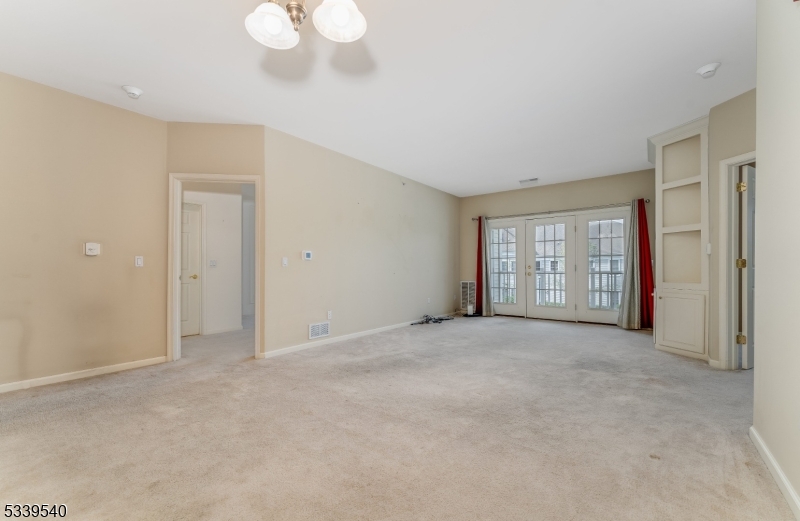 6015 Brookfield Glen Drive, Unit 15 Belvidere, NJ 07823 - Photo 15 of 48 a view of an empty room with a window